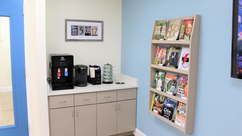 Coffee and magazine area in dental office waiting room