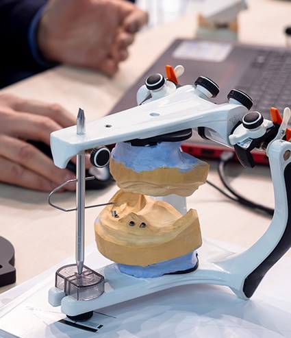 Dental technicians reviewing digital impressions for custom dentures