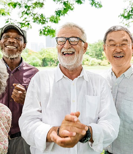 Denture patients smiling together