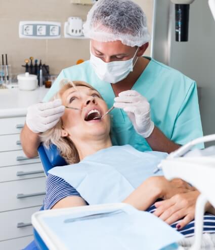 Melbourne dentist performing dental exam on a patient