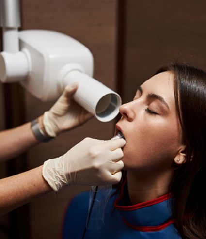 a dental hygienist taking X-rays