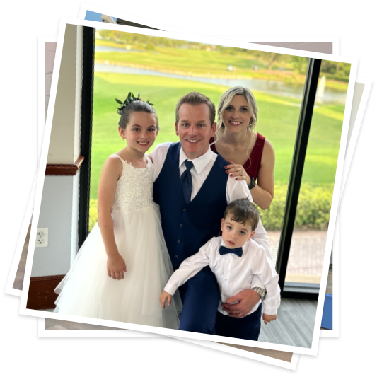 Doctor Rowley at a wedding with his wife and two young children