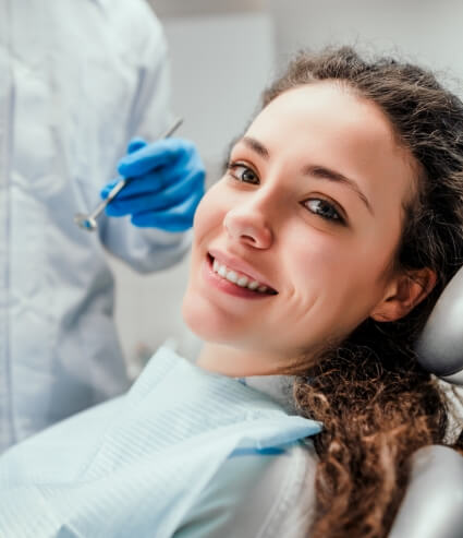 Woman smiling during preventive dentistry checkup in Melbourne