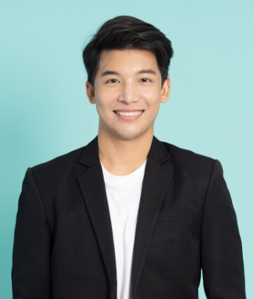 Young man in black dinner jacket smiling