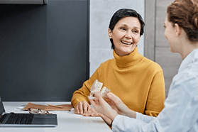 Dentures patient in Melbourne talking over payment options